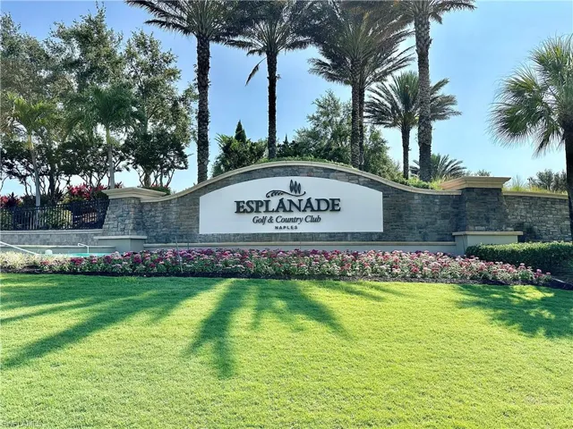 Community / neighborhood sign with a lawn