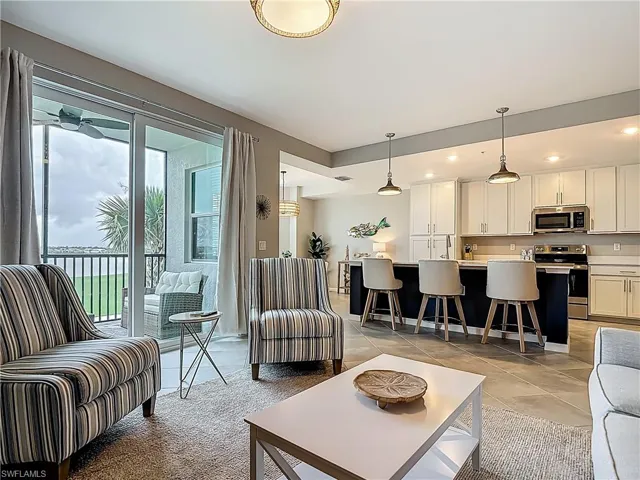 Living area featuring light tile patterned floors and recessed lighting