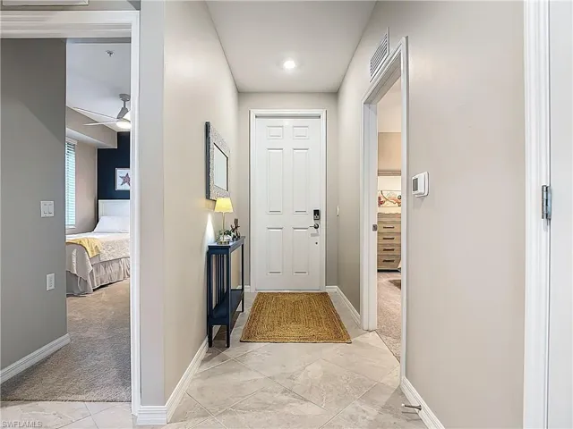 Hall featuring baseboards