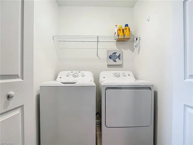 Laundry area featuring separate washer and dryer