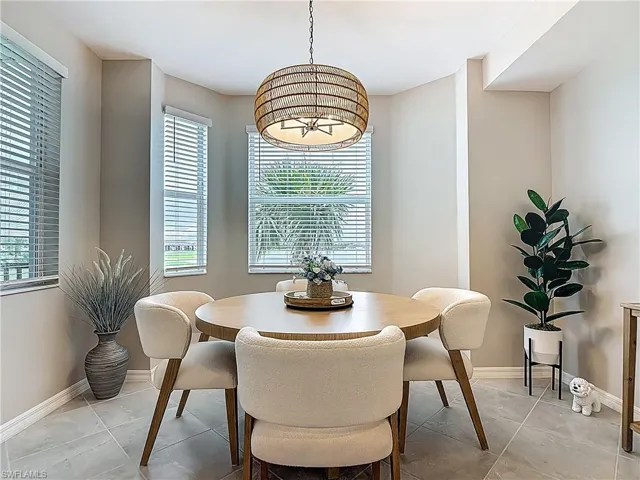 Dining area featuring light tile patterned floors