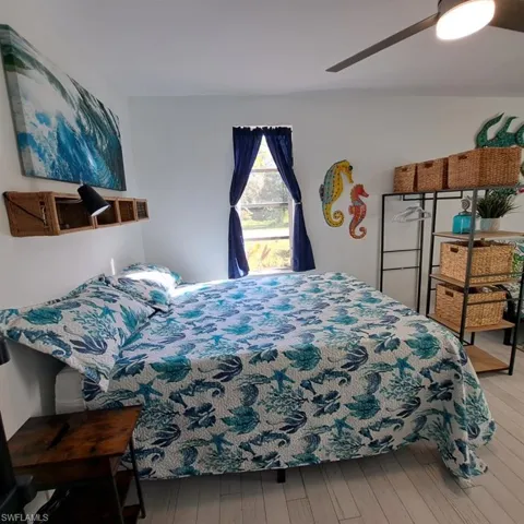 Bedroom featuring light wood-type flooring and ceiling fan