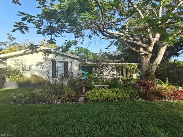 View of home's exterior featuring a lawn