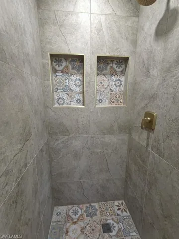 Bathroom with a tile shower