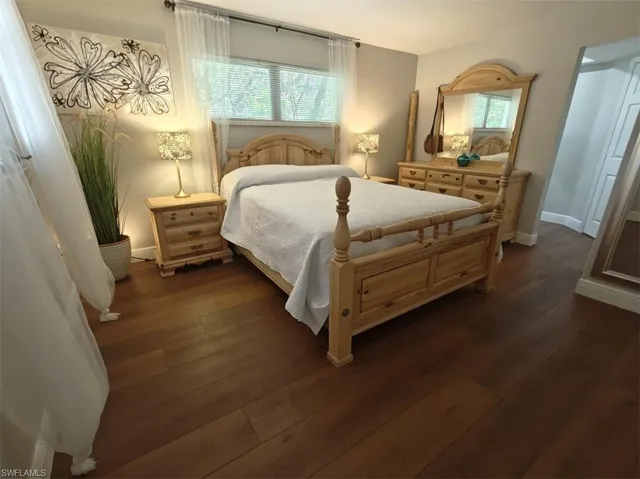 Bedroom featuring dark hardwood / wood-style floors
