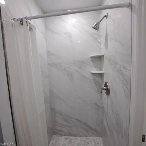 Bathroom with tiled shower