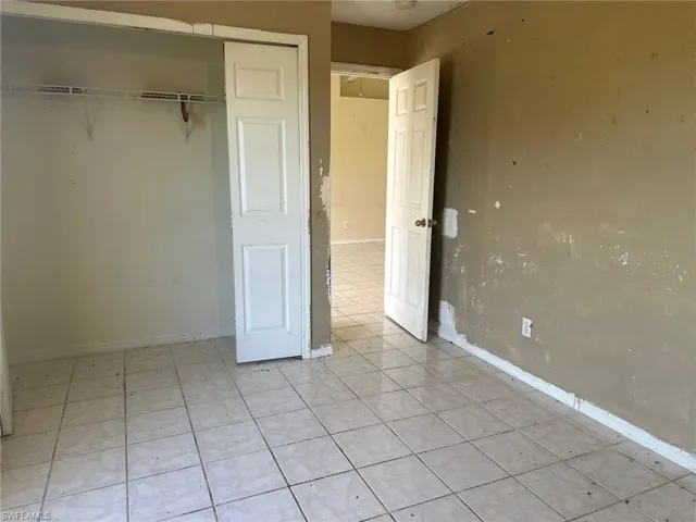 Unfurnished bedroom featuring a closet