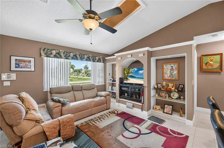 Vaulted ceiling with a central ceiling fan and light fixture