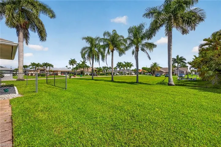 Expansive green space with plenty of room for a pool.