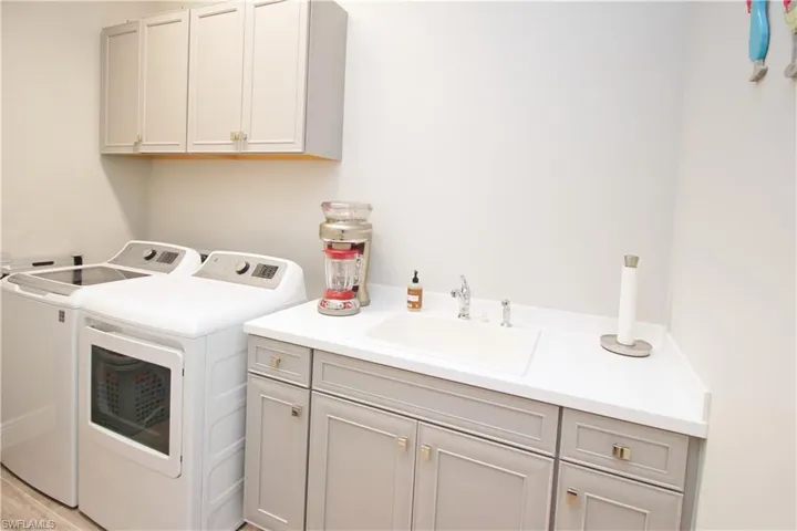 Laundry Room with Extra Cabinets and Deep Sink