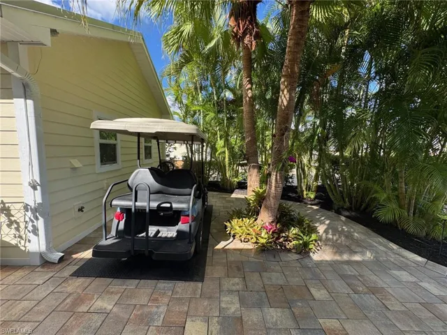 View of patio with a carport