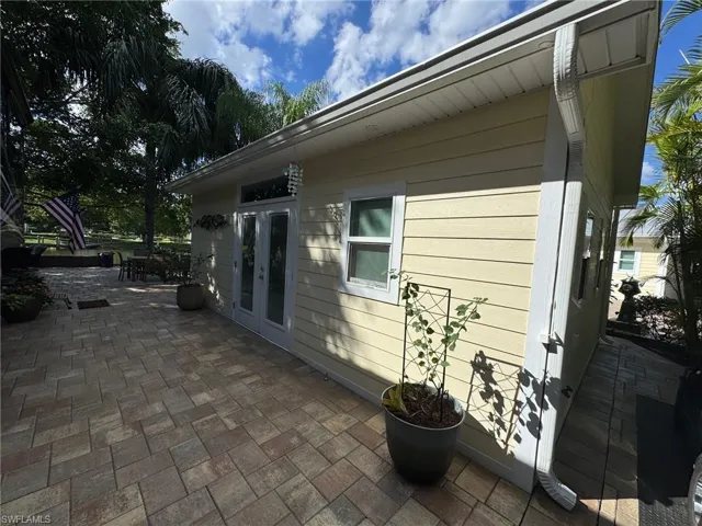 View of side of home featuring french doors and a patio area