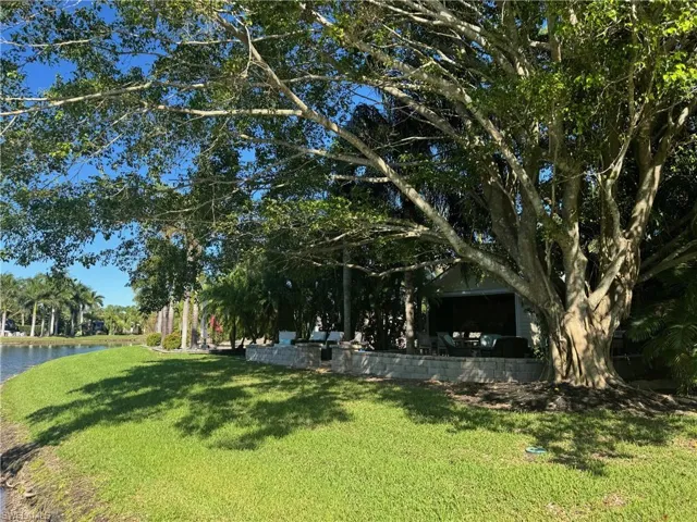 View of yard with a water view