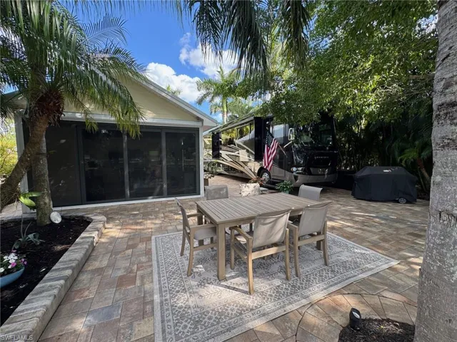 View of patio featuring area for grilling