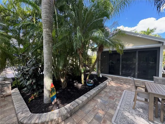 View of patio / terrace featuring a sunroom