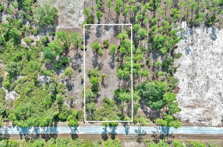 Aerial view of property and surrounding area with property boundaries highlighted