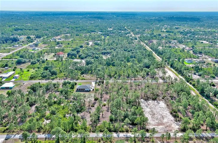 Aerial overview of property's location featuring a forest