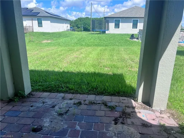 View of yard with a trampoline