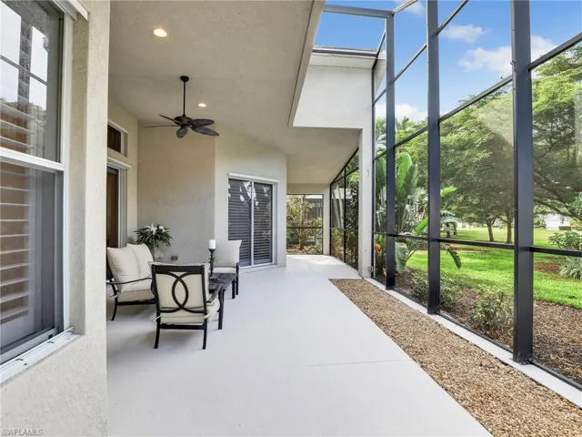 View of patio with a lanai and ceiling fan