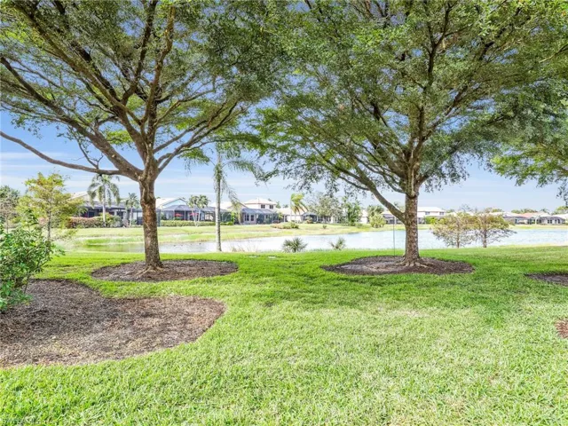 View of yard with a water view