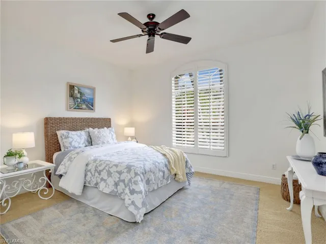 Bedroom with carpet flooring and ceiling fan