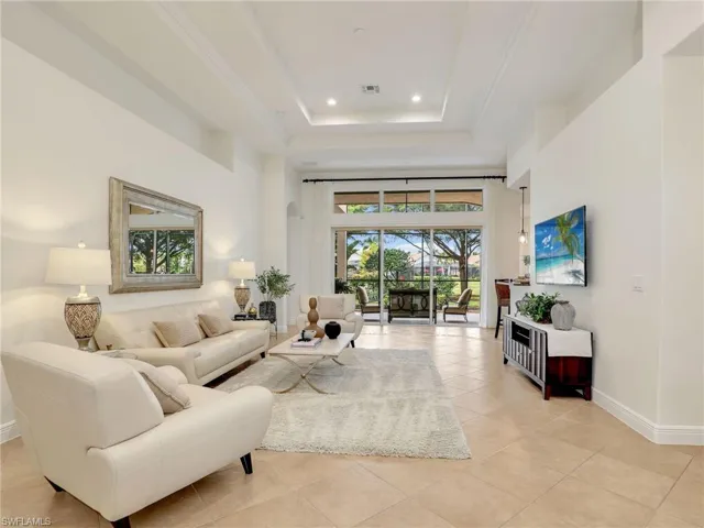 Tiled living room with a tray ceiling
