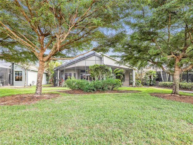 Single story home with a front lawn