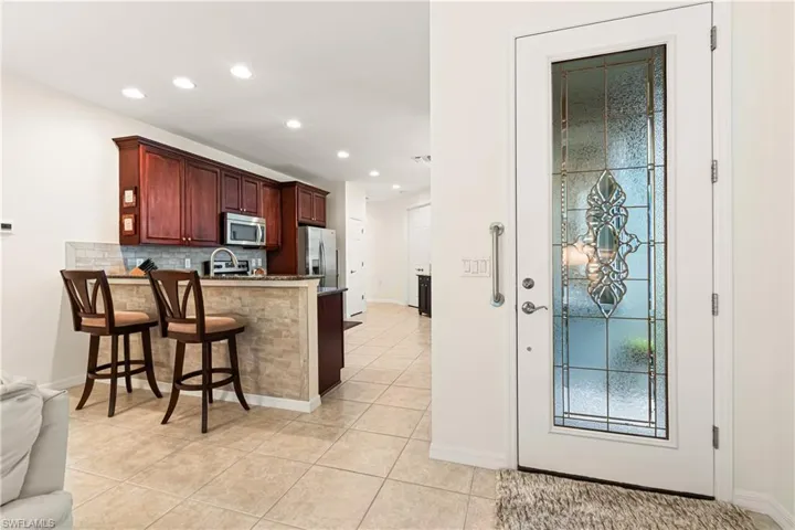 MASTER BEDROOM WITH SLIDING GLASS DOORS TO YOUR POOL & LANAI. PLUS PRIVACY BLINDS TO ENJOY!