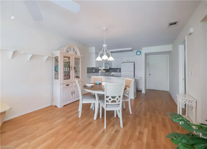 Dining space featuring light wood-style flooring and ceiling fan