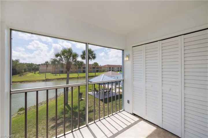 Unfurnished sunroom featuring a water view