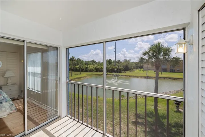 Unfurnished sunroom featuring a water view