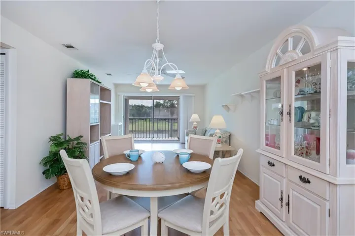 Dining space featuring hanging lights and light wood-style floors