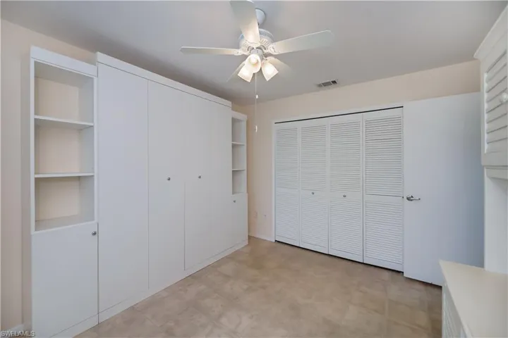 Unfurnished bedroom with a closet and ceiling fan
