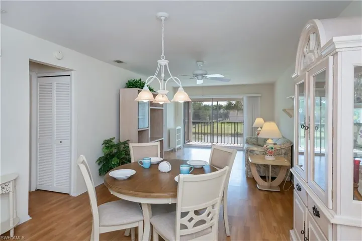 Dining area featuring light wood-type flooring and a ceiling fan