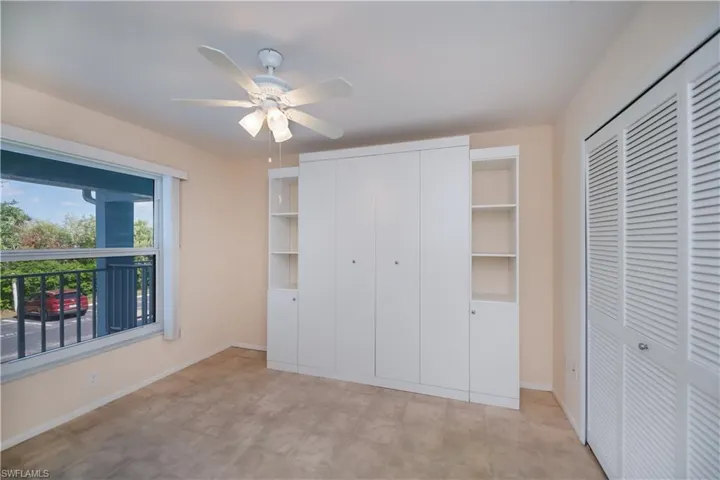 Unfurnished bedroom with baseboards and a ceiling fan