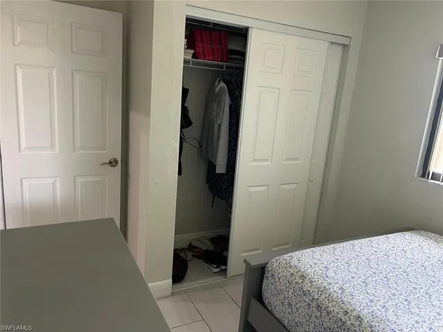 Sliding closet doors with interior shelving and hanging space