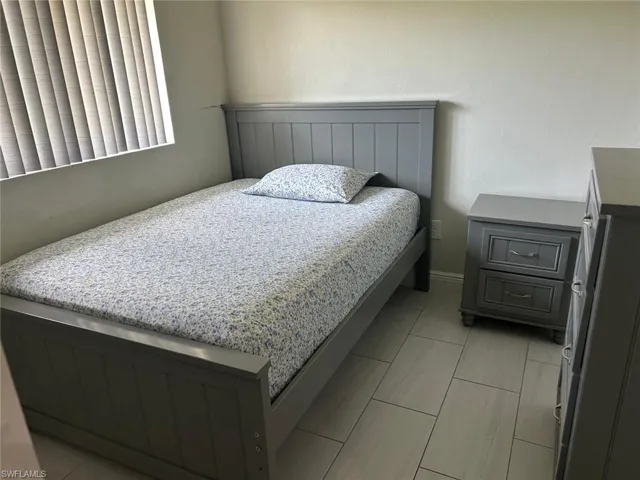 Light-toned flooring featuring rectangular tile
