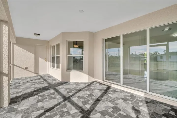 View of patio / terrace with a sunroom