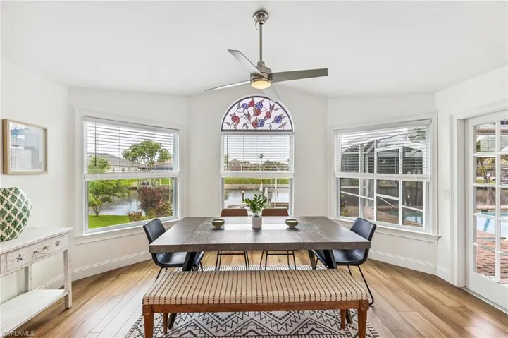 Dining room with light wood-type flooring and a ceiling fan