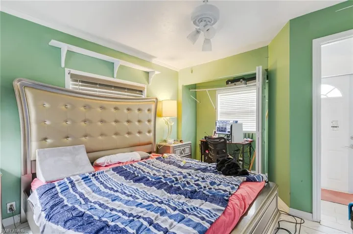 Bedroom featuring baseboards and tile patterned flooring