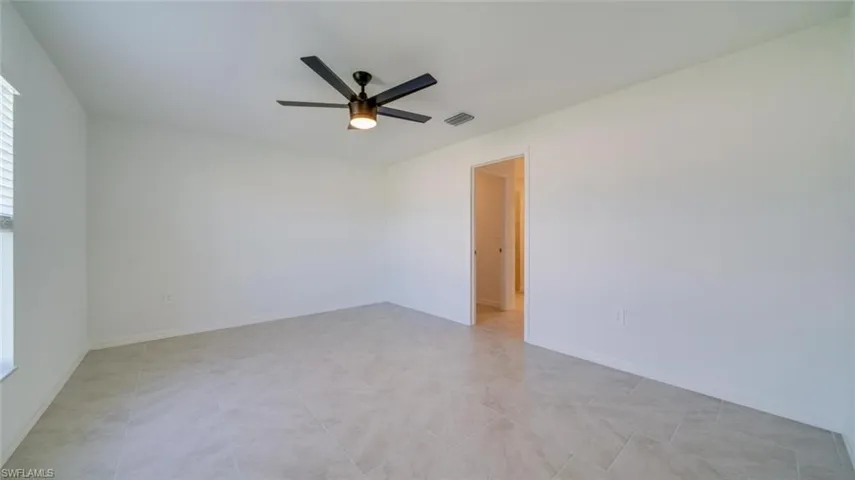 Unfurnished room with ceiling fan