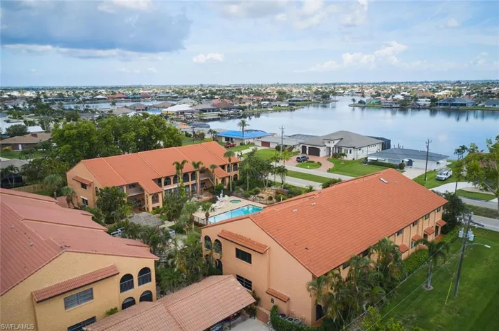 Aerial perspective of suburban area with a large body of water
