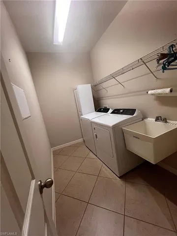 Spacious Laundry Room With Laundry Sink & Newer Washer, Dryer