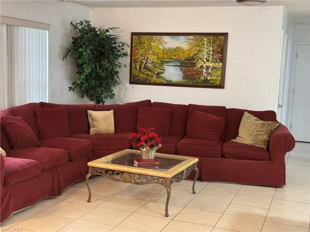 Living room featuring light tile patterned floors
