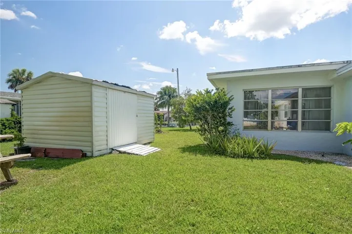 View of yard with a storage shed