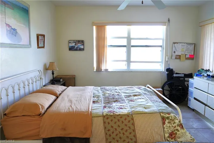 Tiled bedroom with ceiling fan