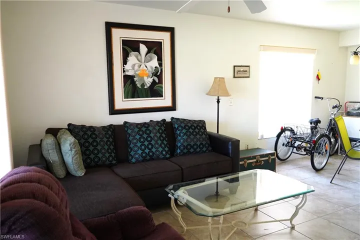 Tiled living room with ceiling fan