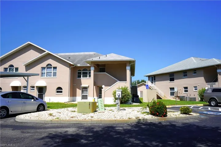 View of front of house featuring central air condition unit