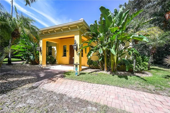 View of exterior entry featuring stucco siding