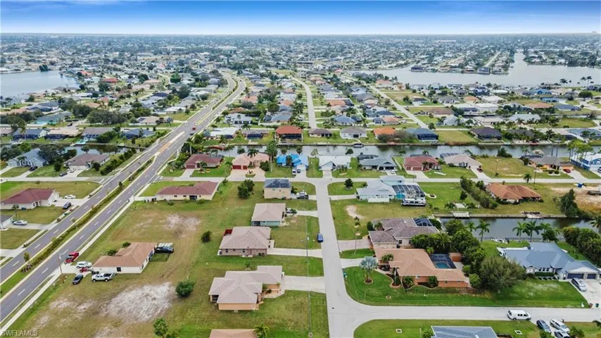 Aerial view with a water view and a residential view